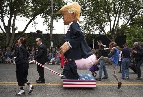 Protesters kicking Donald trump Butt